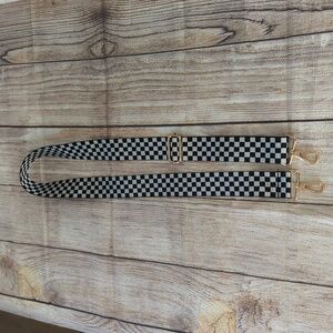 Adjustable black and white checkered crossbody strap